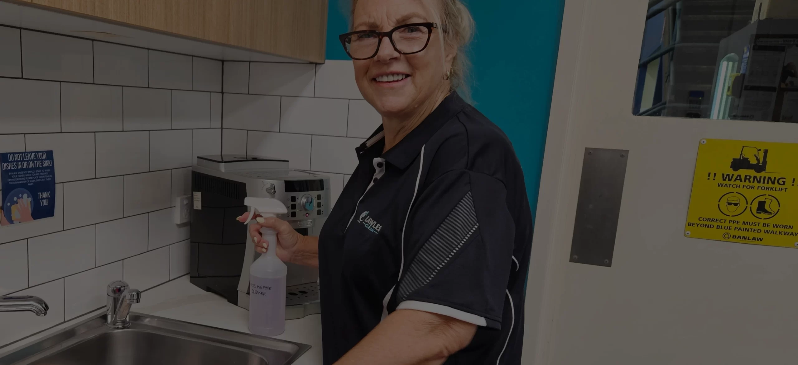 Flawless Clean team member cleaning a workplace kitchen